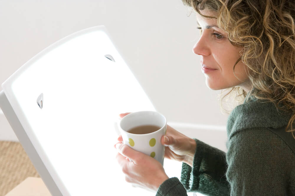 woman light therapy depression